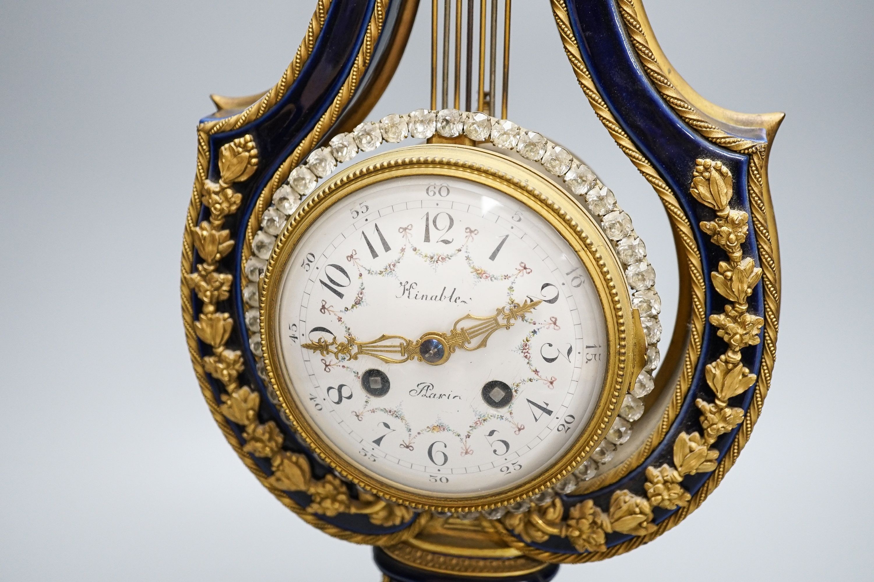 A Louis XV style ormolu mounted blue glazed porcelain lyre-shaped mantel clock (AF) 49cm, paste set surround to the pendulum